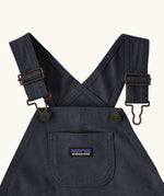 Patagonia Little Kids Stand Up Shortall dungarees in an navy showing small pouch chest pocket and hook & loop buckles