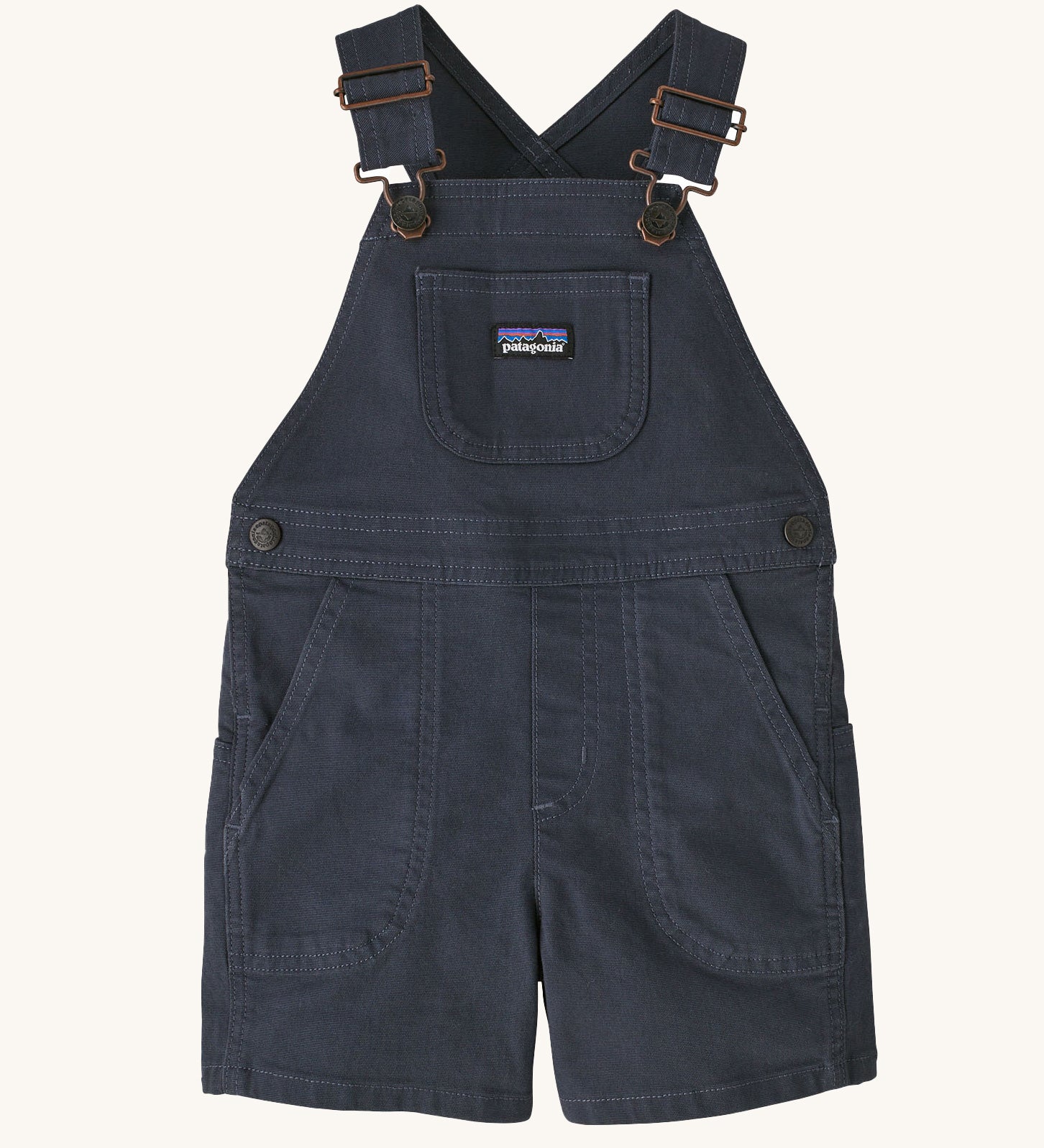 The Patagonia Little Kids Stand Up Shortalls in an Smolder Blue colour on a plain background.