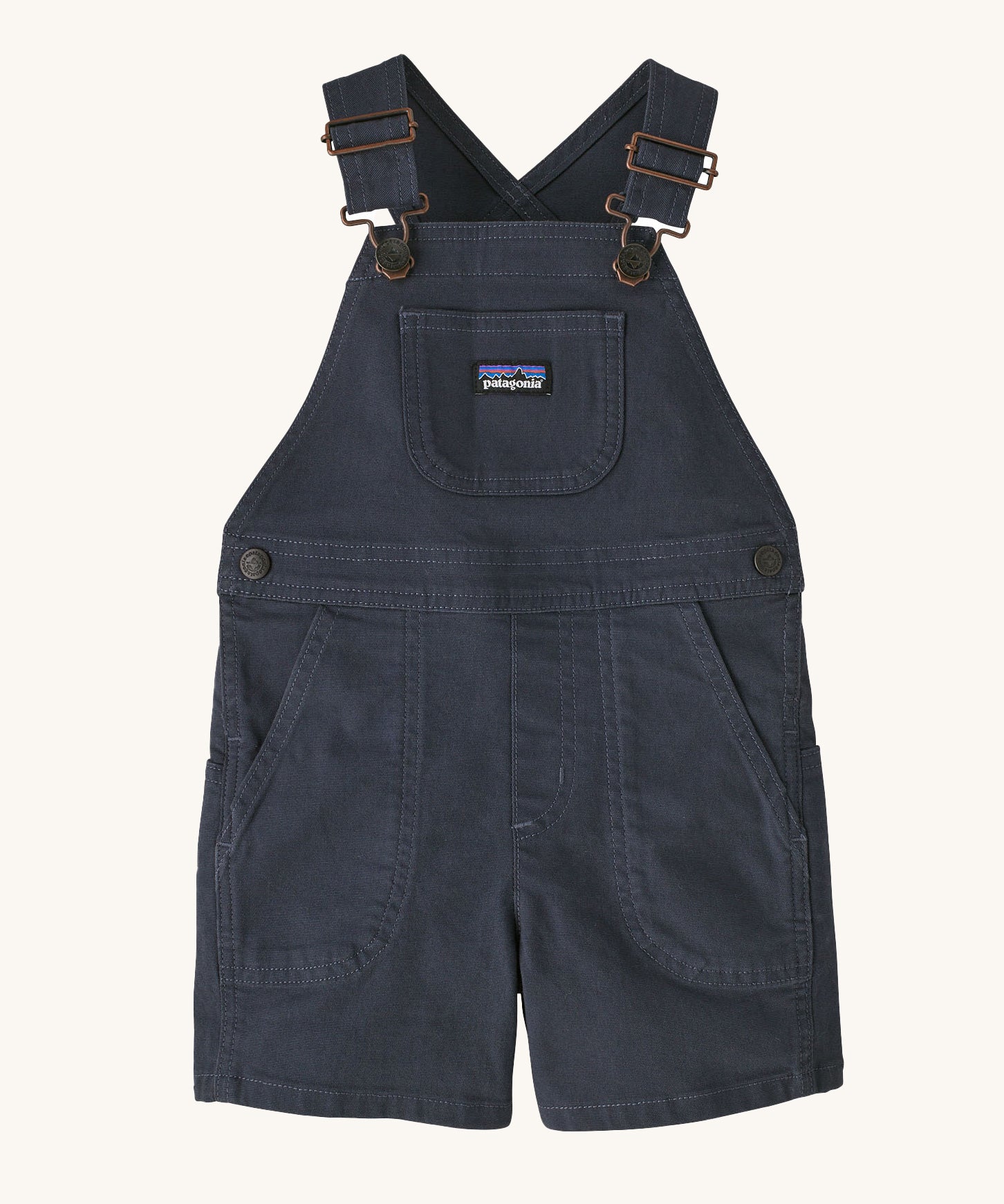 The Patagonia Little Kids Stand Up Shortalls in an Smolder Blue colour on a plain background.