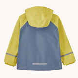 The back of a Patagonia Little Kids Torrentshell 3L Waterproof Jacket in the Nearly Green colourway. A waterproof jacket in a yellow/grey and grey colourblock design. Features a full length zip, a hood with a elasticated cuff, 2 side pockets and a reflective strip on the cuffs.