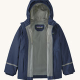 The Patagonia Little Kids Torrentshell 3L Waterproof Jacket in a New Navy colour on a plain background. The jacket's zip is fullt open showing the grey coloured lining. 