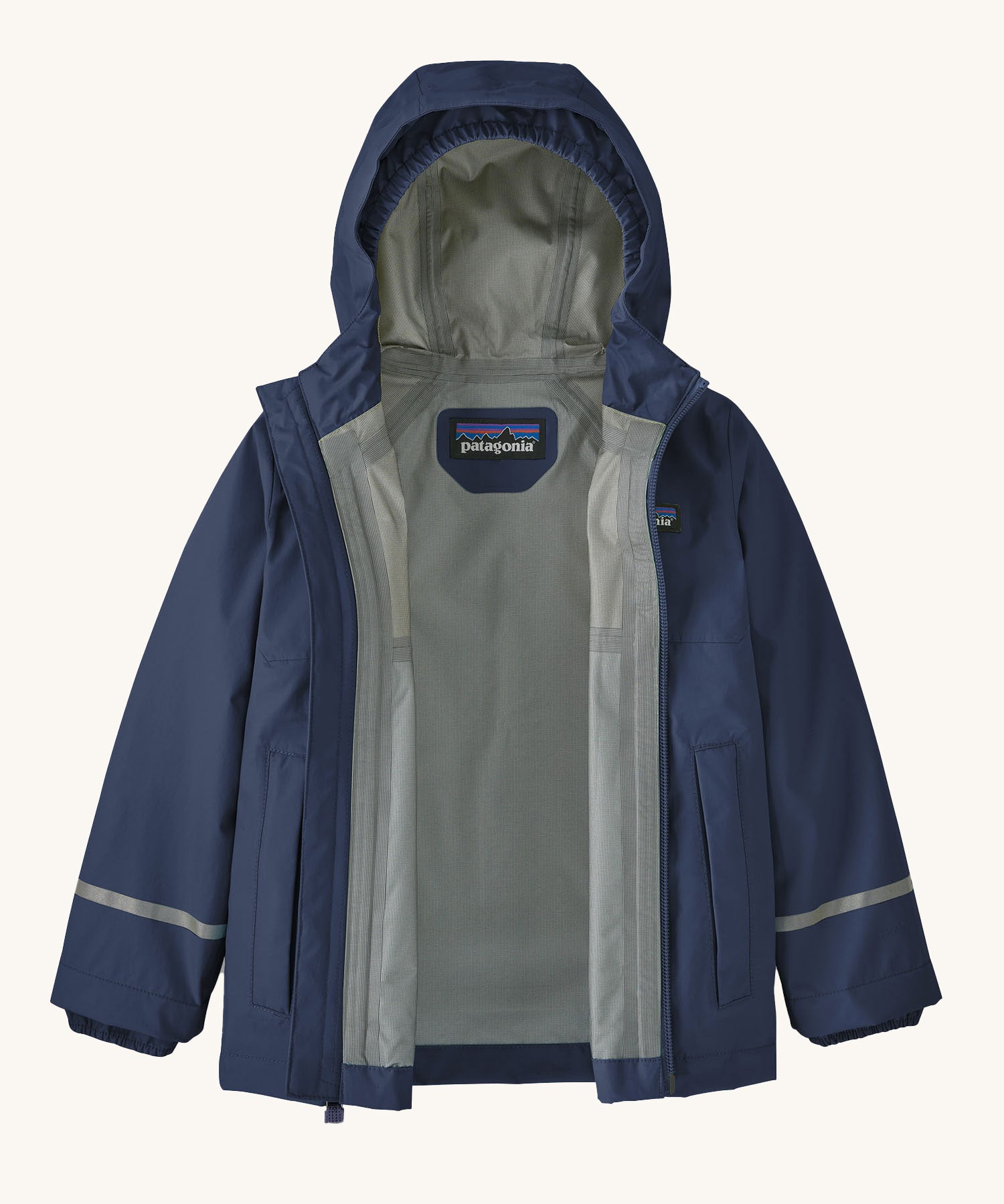 The Patagonia Little Kids Torrentshell 3L Waterproof Jacket in a New Navy colour on a plain background. The jacket's zip is fullt open showing the grey coloured lining. 