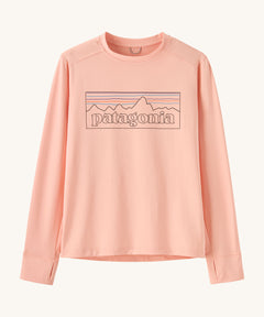 Patagonia kids long sleeve tshirt in a light pink colour with logo outline on a cream background.