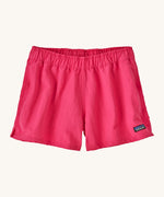 Patagonia women's barely baggies shorts in bright pink on a cream background.