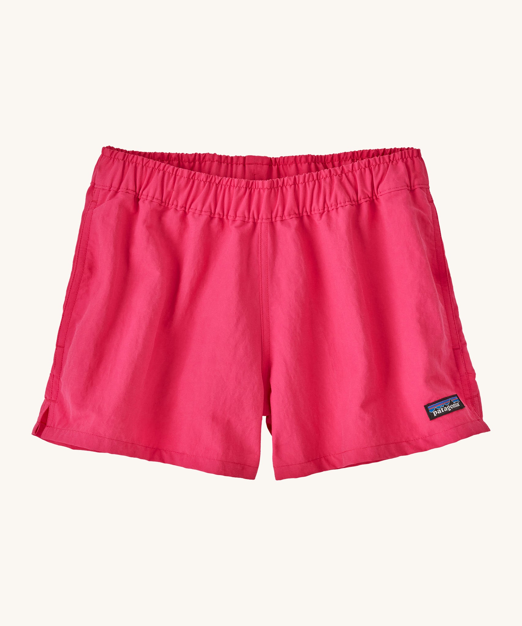 Patagonia women's barely baggies shorts in bright pink on a cream background.