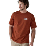 A man wearing the Patagonia Men's 73 Skyline Organic T-Shirt Burnished Red