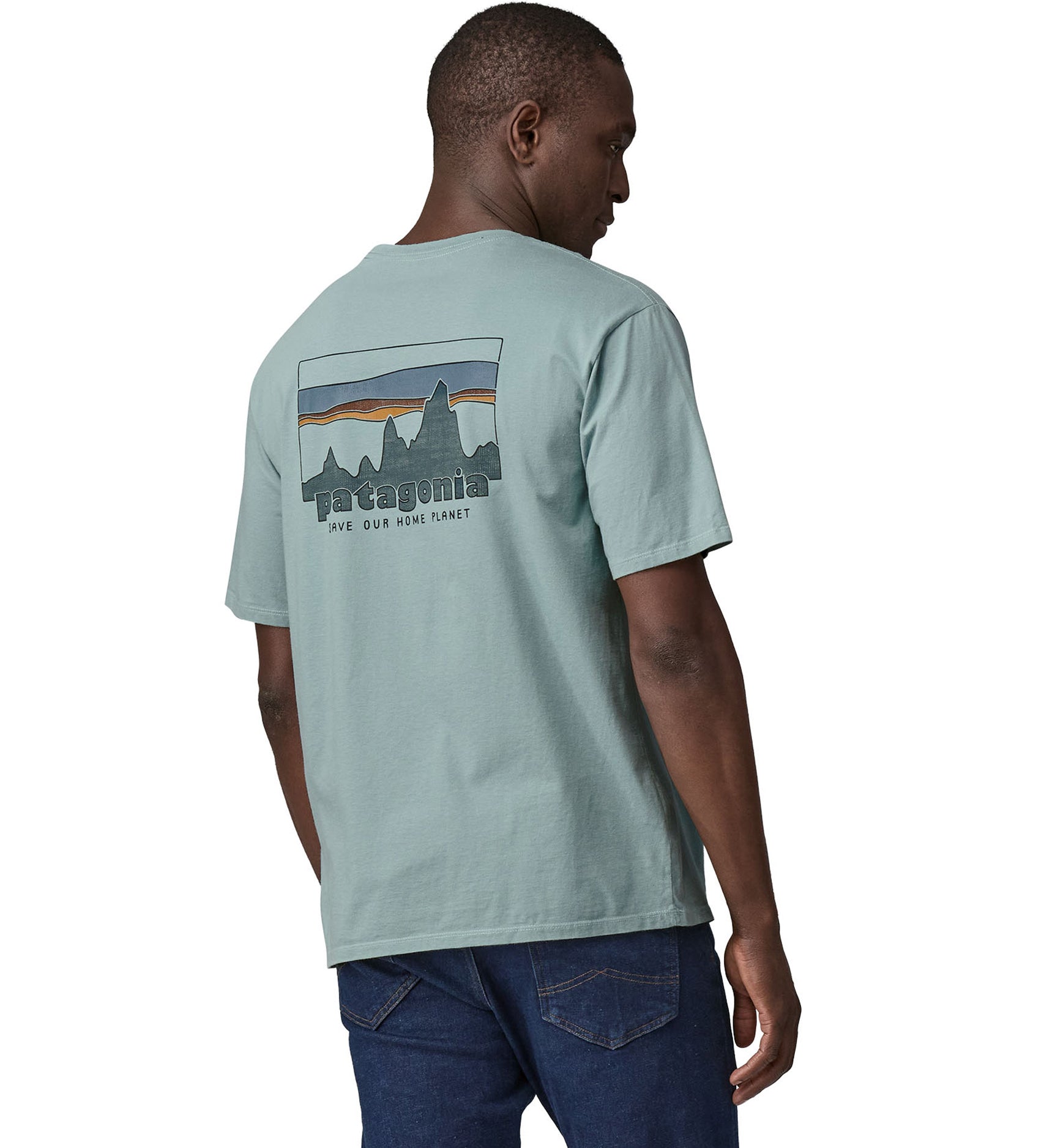 A man wearing the Patagonia Men's 73 Skyline Organic T-Shirt Thermal Blue showing the back 