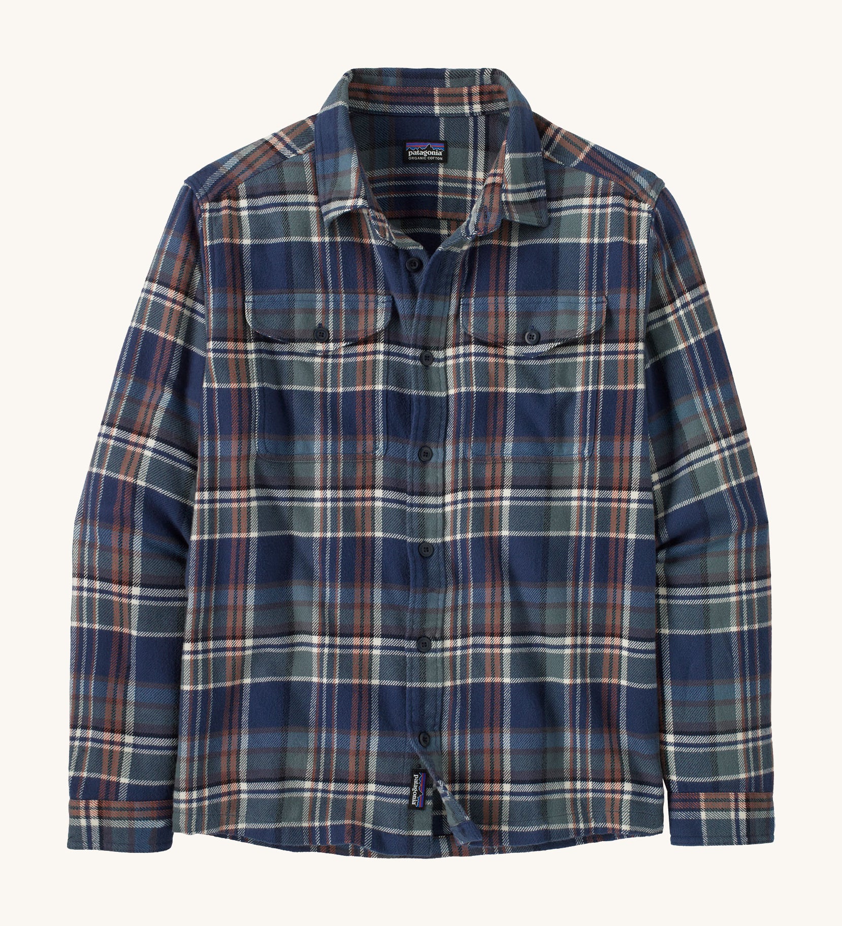 Patagonia mens flannel shirt in  new navy colour way on a cream background.