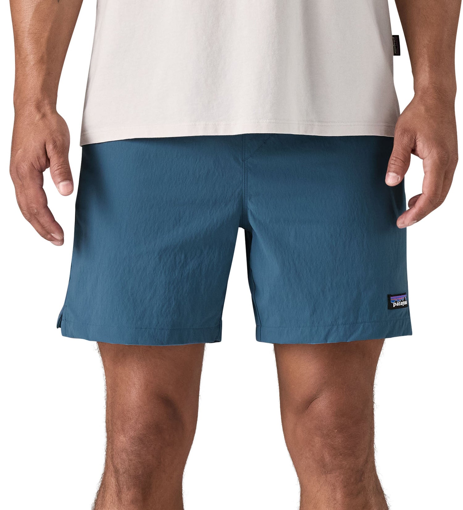 patagonia mens baggies shorts in a dark blue colour worn by a man front detail