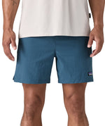 patagonia mens baggies shorts in a dark blue colour worn by a man front detail