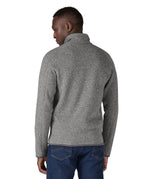 Close up of man stood up wearing the Patagonia stonewash better sweater jacket showing the back stitching detail