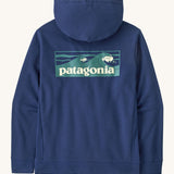 Patagonia men's Boardshort Logo Uprisal Hoody in clement blue. A thick hooded pull over with a large brand patch in a wave design 