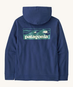 Patagonia men's Boardshort Logo Uprisal Hoody in clement blue. A thick hooded pull over with a large brand patch in a wave design 