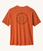 Patagonia Men's Cap Cool Daily Graphic Shirt in a Lands Redtail Rust orange colour showing the back of the t-shirt