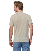 Back of a man wearing a Patagonia men's Capilene Cool merino blend shirt in a cream colour.