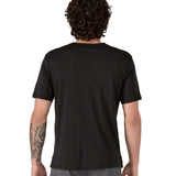 Man wearing a Patagonia men's Capilene merino blend black short sleeved t-shirt with a loose fit facing away.