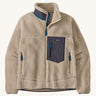 A Patagonia Men's Classic Retro-X Jacket in a Natural / Smolder Blue colour way on a plain background. 