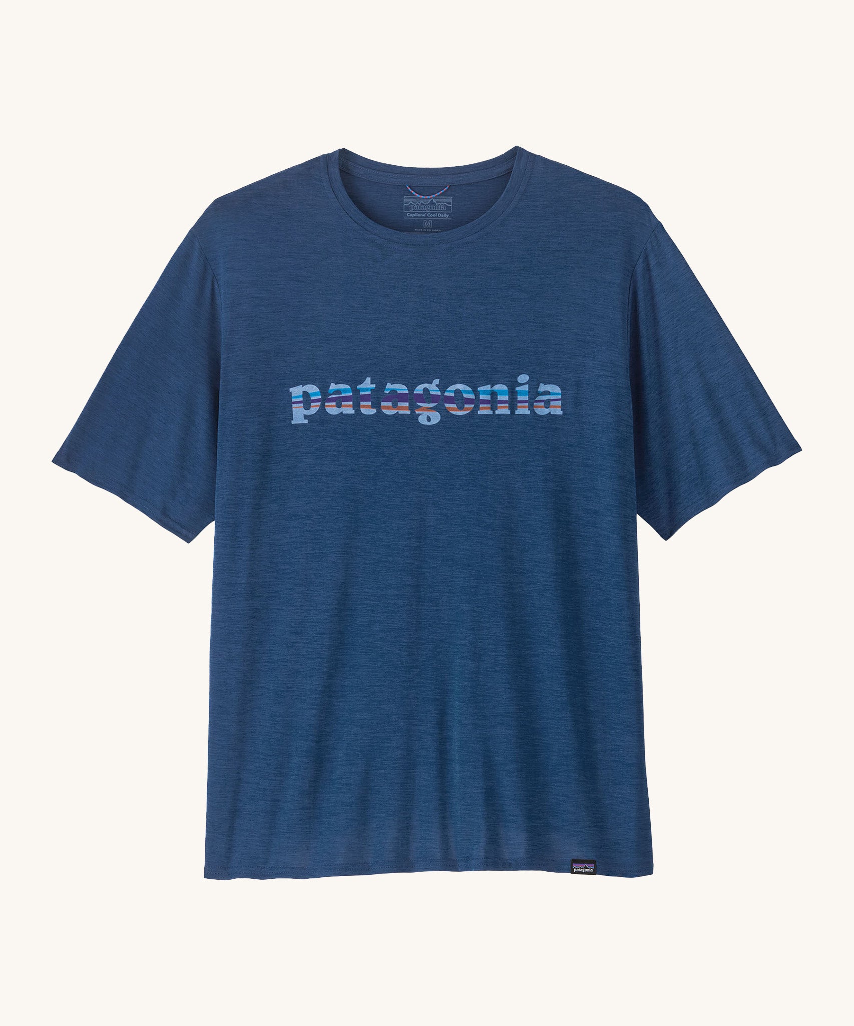 Patagonia Men's Capilene Cool Daily Graphic Shirt is a warm blue coloured top with short sleeves and the brand name printed across the chest. 