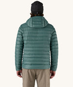 A man wearing the Patagonia Men's Down Sweater Hoody Jacket in a Wetland Blue colour. He is facing away from the camera showing the back of the jacket. 