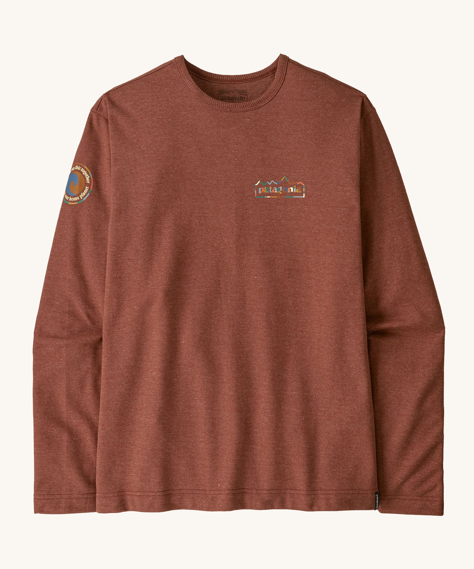 Patagonia men's unity fitz wildrise crew sweatshirt in dried vanilla. A lightweight long sleeve top in brown with brand logo on the chest and a patch on the right shoulder