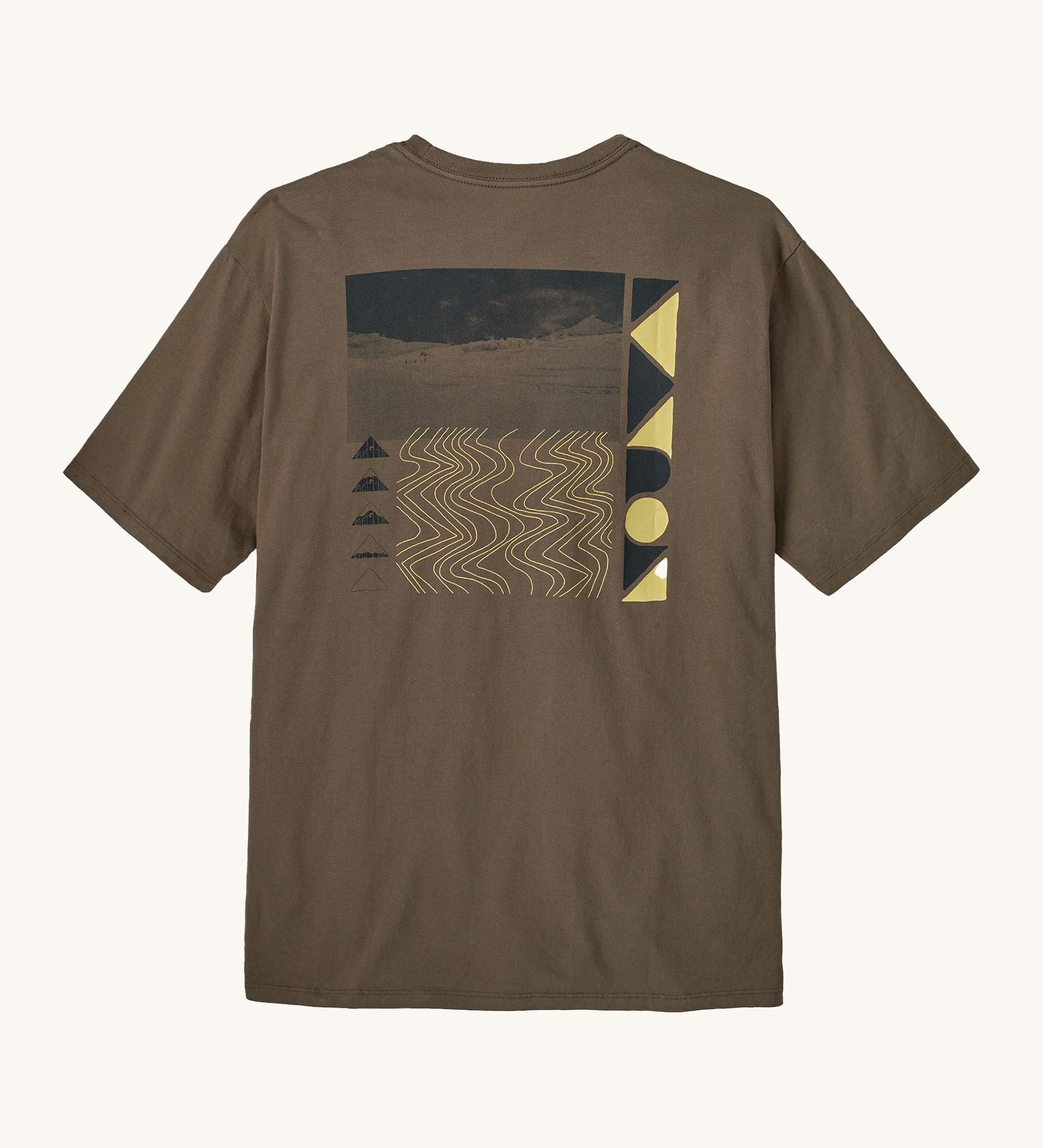 Patagonia mens driftways organic t-shirt. A cotton top in pale brown with a landscape and geometric patterns printed on the front.