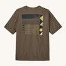 Patagonia mens driftways organic t-shirt. A cotton top in pale brown with a landscape and geometric patterns printed on the front.