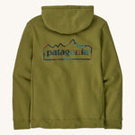 Patagonia unity Fitz mens hoodie in dark green and blue logo on the back on a cream background.