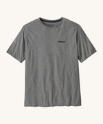 Patagonia men's fitz roy tee in gravel heather. A grey lightweight long sleeve top with brand logo on the front chest and a small icon patch on the right arm. 
