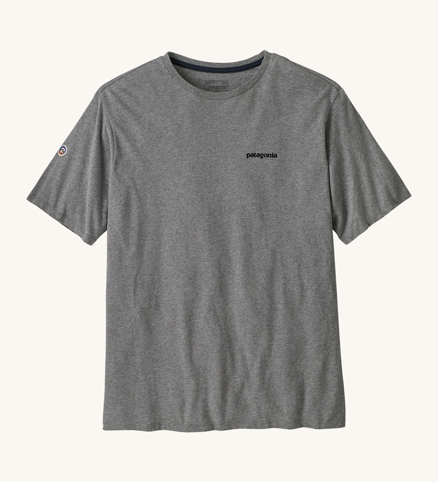 Patagonia men's fitz roy tee in gravel heather. A grey lightweight long sleeve top with brand logo on the front chest and a small icon patch on the right arm. 