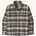 Patagonia men's fjord shirt. A long sleeve buttoned flannel style shirt in grey and brown colours, features 2 chest pockets and a logo patch stitched on the inside.