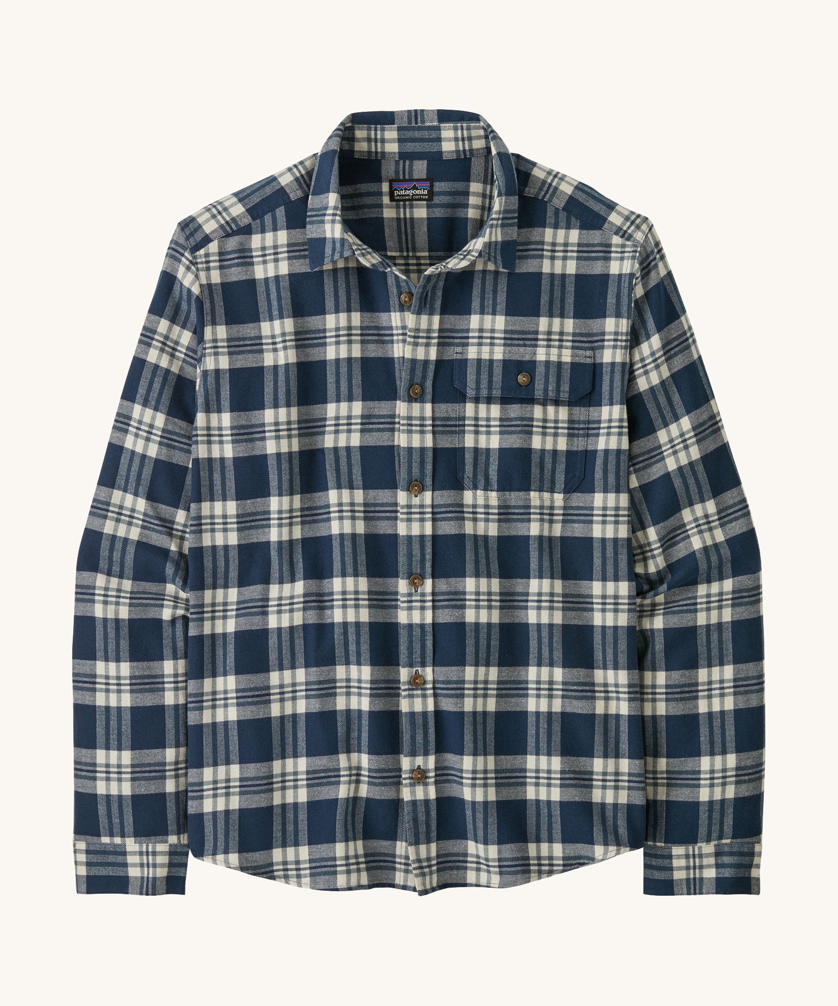 Patagonia men's lightweight flannel shirt in a new navy colour way on a cream background.