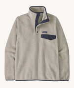 A Patagonia Men's Lightweight Synchilla Snap-T Fleece in a Oatmeal Heather / Smolder Blue colour on a plain background. 