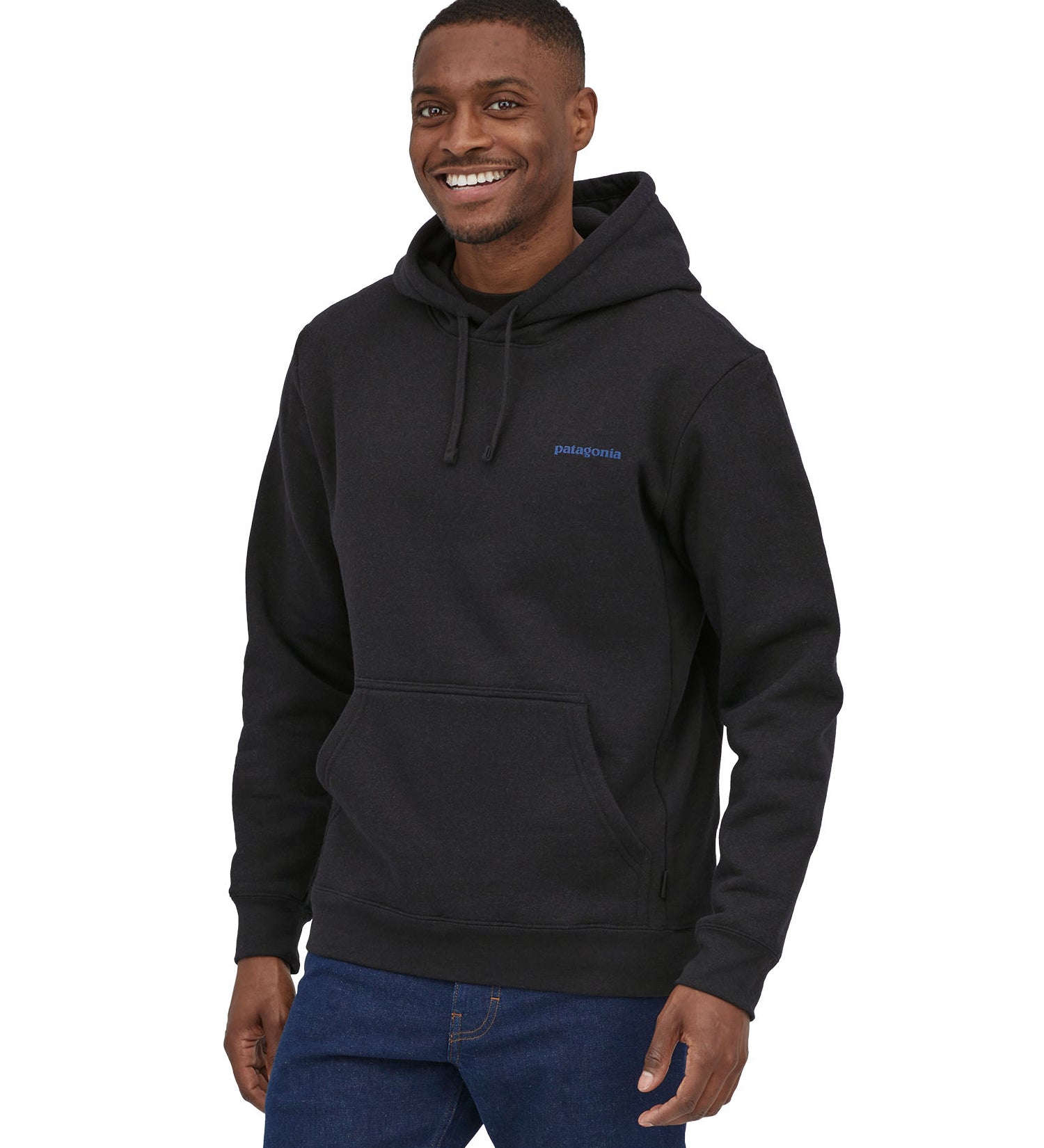 Patagonia men's uprisal hoodie in ink black worn by a man