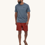 A person wearing Patagonia Men's Baggies Shorts Longs