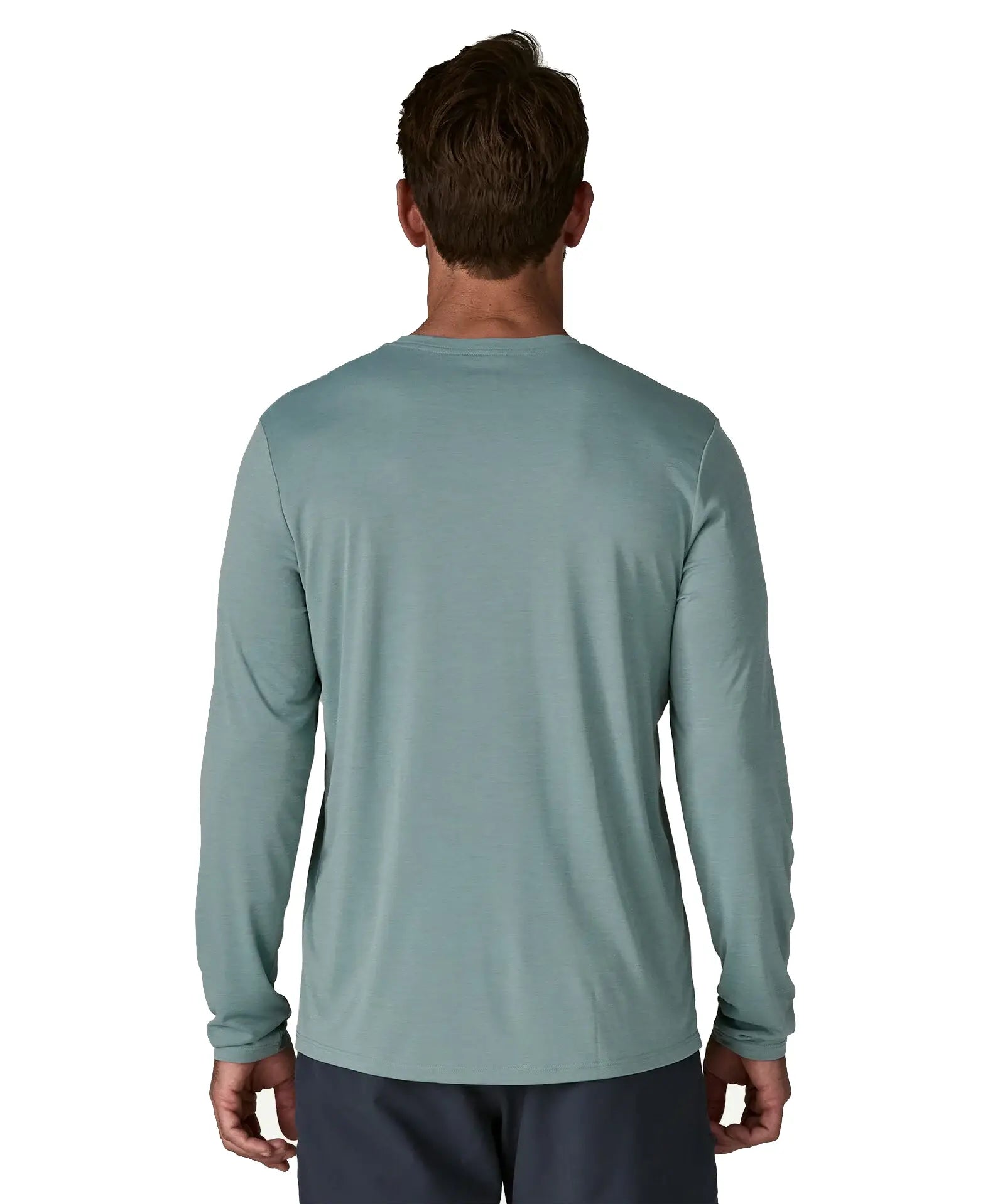 Back of man wearing Patagonia men's long sleeved capilene cool daily tshirt in sage blue. T-shirt has a relaxed fit 