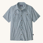 Patagonia Back Step Shirt, made with a blend of 55% industrial hemp and 45% organic cotton. In light blue with an understated Mountain Breeze print, it features short sleeves, coconut buttons, and two chest pockets. 