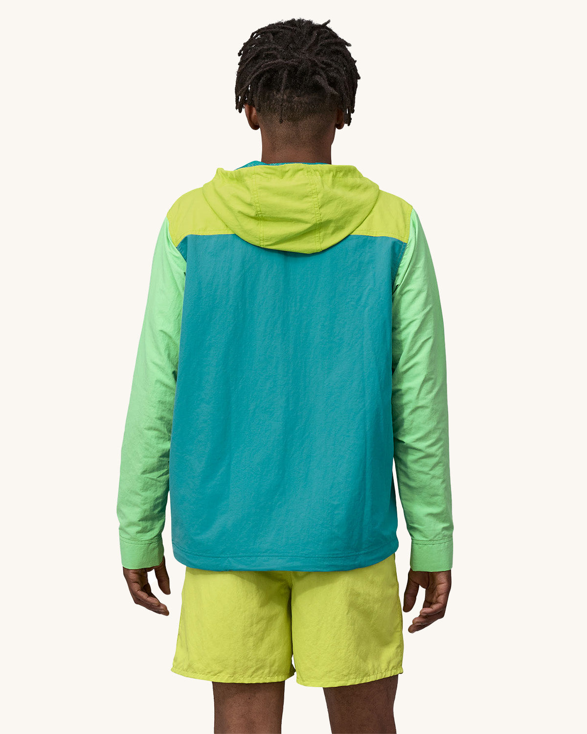 A person wearing Patagonia Men's Baggies Shorts Longs - Buckhorn Green