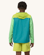 A person wearing Patagonia Men's Baggies Shorts Longs - Buckhorn Green