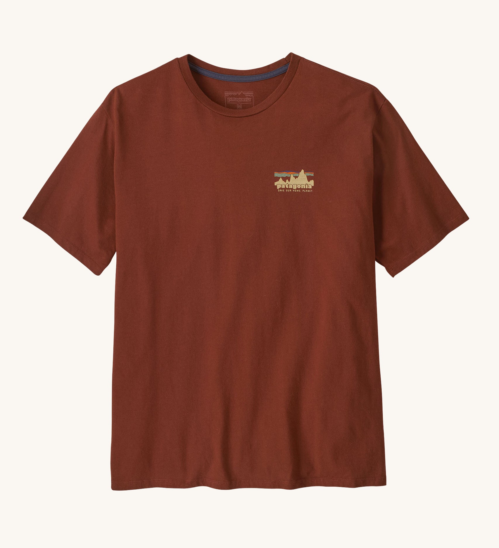 Patagonia Men's 73 Skyline Organic T-Shirt. A brown top with short sleeves with a skyline style brand logo on the left chest area. 
This t-shirt is a part of a wide range of Patagonia clothing and accessories available here at Babipur. 