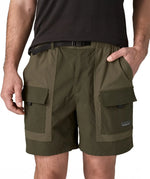Close up of Patagonia Men's Outdoor Everyday Shorts in Pine Needle Green being worn. The man has a hand in one of the pockets.