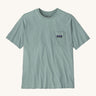 Patagonia men's short sleeve top with a pocket on the front in a light blue colour on a cream background.