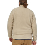 The view of a man's back wearing a Patagonia Men's Retro Pile Jkt in a cream colour