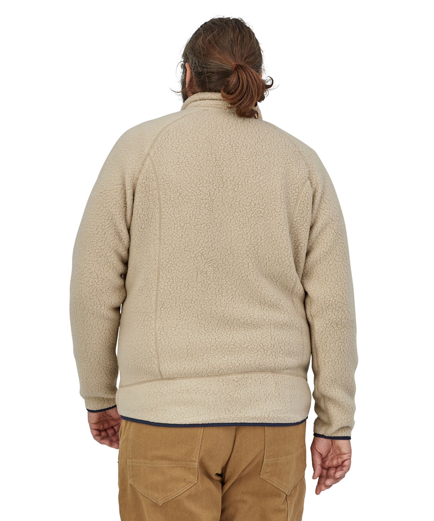 The view of a man's back wearing a Patagonia Men's Retro Pile Jkt in a cream colour