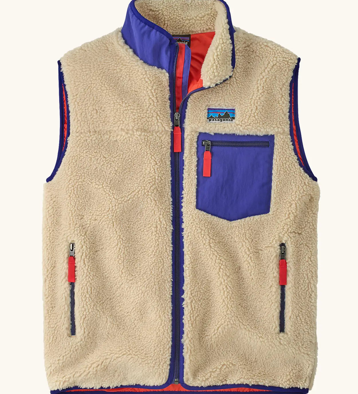 retro x patagonia vest, gilet bodywarmer style with no arms, cream fleece, blue contrasting pockets and red zip detail