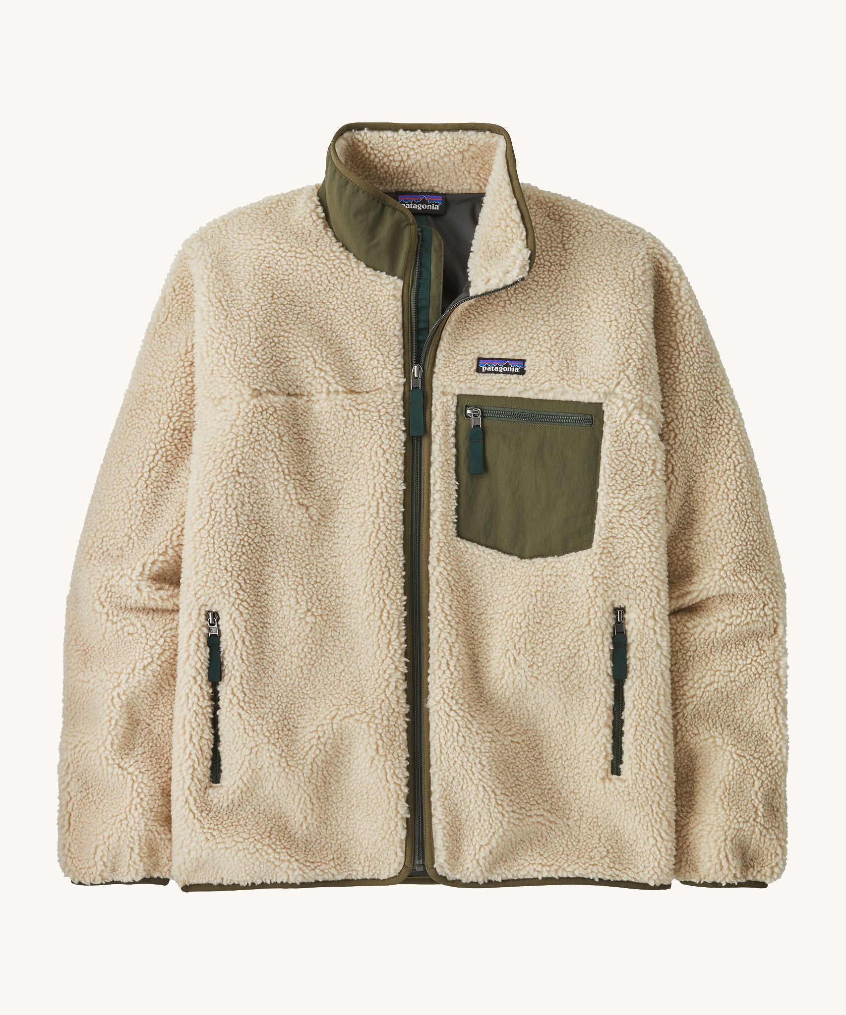 A Patagonia men's classic retro-x jacket in a dark natural / basin green colour way. A thick fleece with a full length zip, 2 side pockets and a chest pocket with the logo patch stitched above.