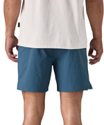 patagonia mens baggies shorts in a dark blue colour worn by a man back detail