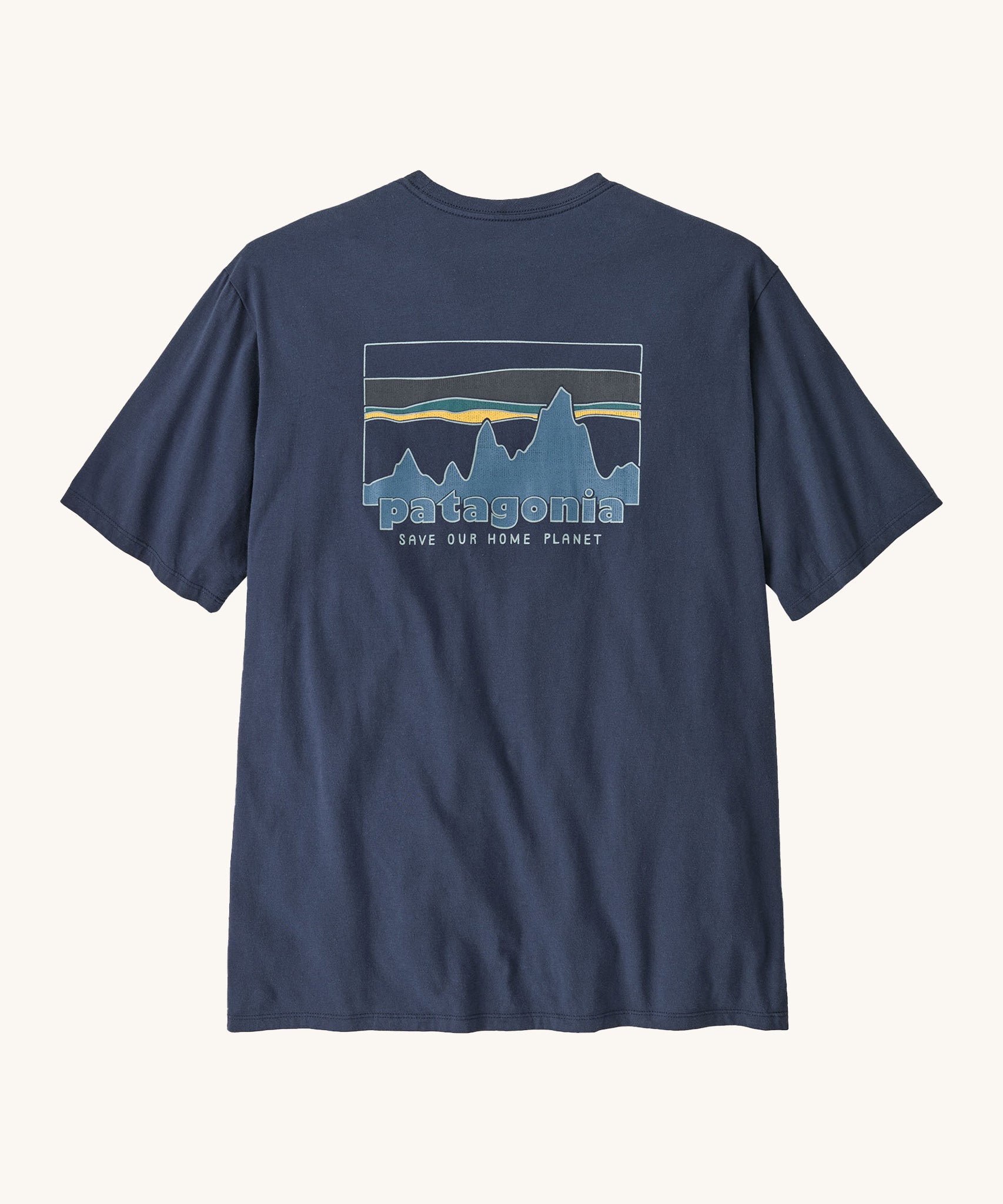 Patagonia men's 73 skyline short sleeve top in navy on a cream background.
