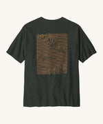 Patagonia men's  Strataspire tee in old growth green is a short sleeve top with a big mountain scape print in pale orange on the back 