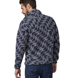 A man wearing a Patagonia Men's Synch Snap-T Pull Over in New Navy showing the back of the jacket
