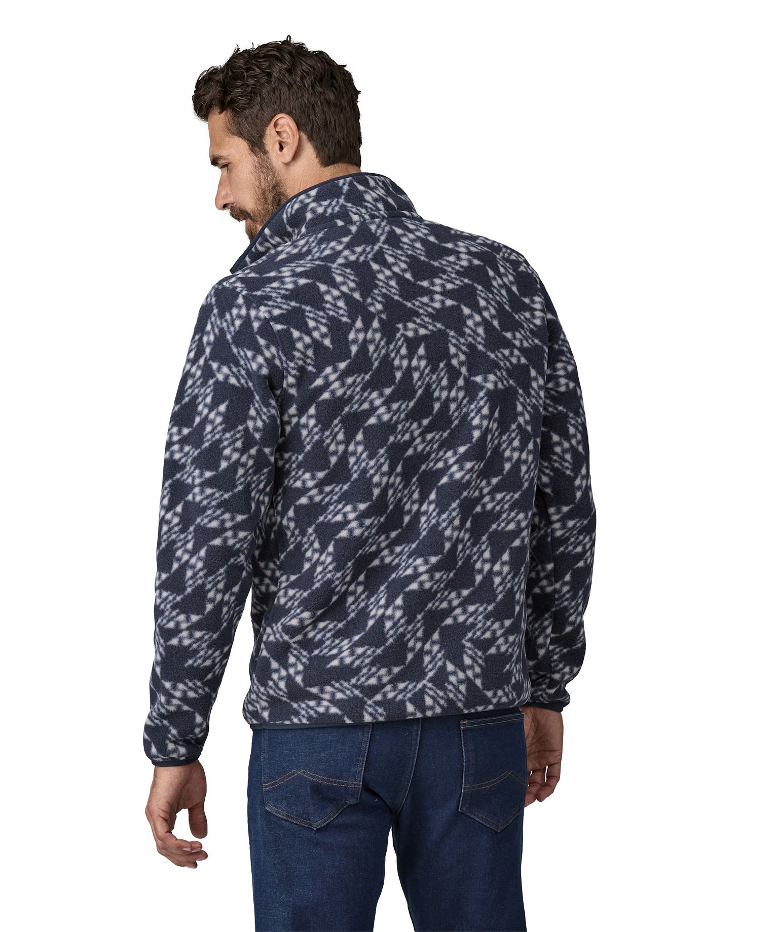 A man wearing a Patagonia Men's Synch Snap-T Pull Over in New Navy showing the back of the jacket